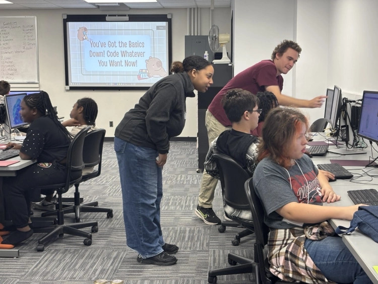 students sitting in front of computers